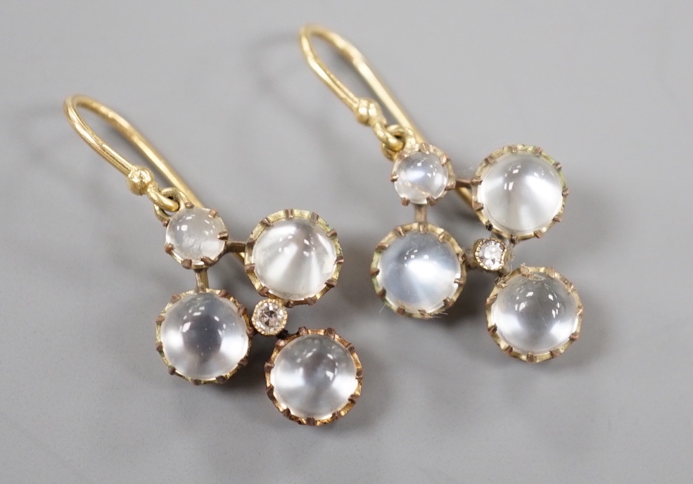 A pair of yellow metal, moonstone and diamond cluster set drop earrings, 3cm, gross weight 4.2 grams.